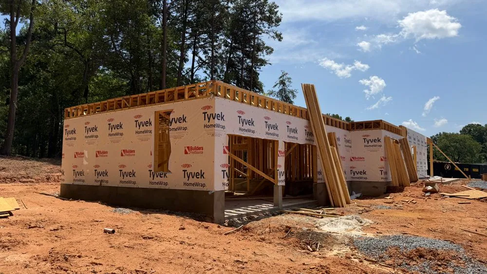 A Lev Developments custom home under construction in Troutman, North Carolina, framed and wrapped for weather